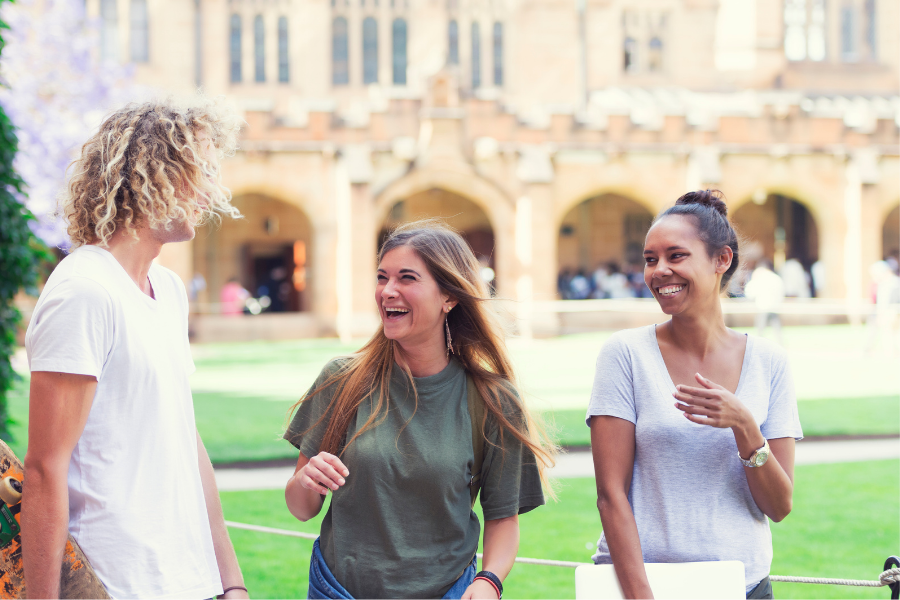 Group of university students laughing together on campus, representing occupational therapy student placement opportunities at Koru Allied Therapies.